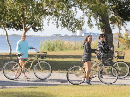 Women bike riding on Alabama Gulf Coast