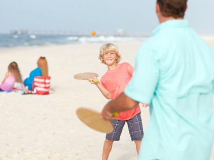 Family plays on Alabama's white sand beaches