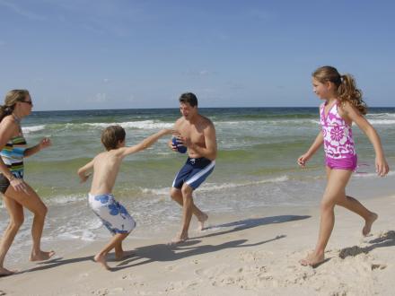 Family plays on Alabama's beaches