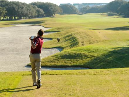 Man golfing Gulf Shores AL