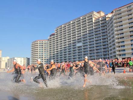 Swimmers start for Brett Robinson Alabama Coastal Triathlon Gulf Shores AL