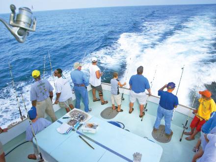 Men fishing on a charter boat Orange Beach Al
