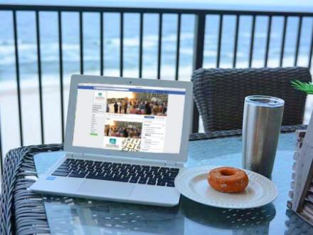 Facebook on laptop on balcony