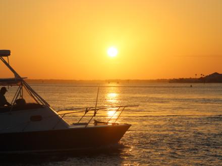boat at sunrise perdido pass Orange Beach Al