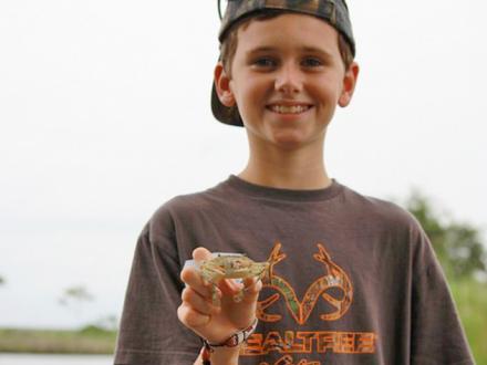 Boy holding small crab