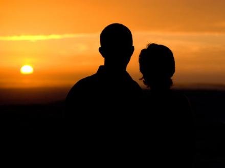 couple watching the sun set in Orange Beach AL