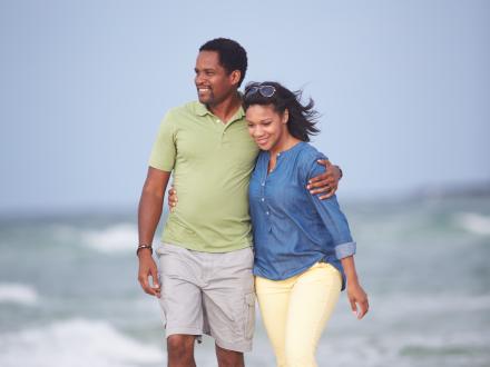 couple walking on the beach in Gulf Shores AL