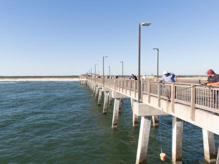 Men fishing from Gulf State Park Pier