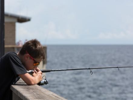 boy fishing at the Gulf State Park Pier Gulf Shores Al