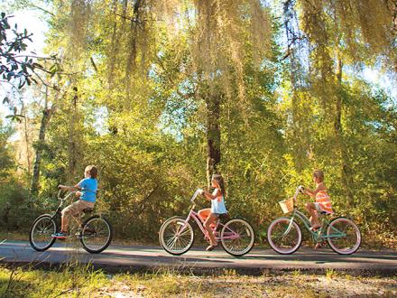 Kids biking on Hugh S Branyon Backcountry Trail in Gulf Shores AL