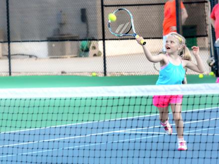 Young girl playing tennis