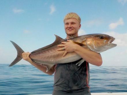 Fisherman holding Amberjack fish