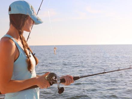 Woman fishing in Orange Beach
