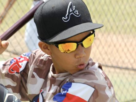 Baseball Player wearing sunglasses and hat