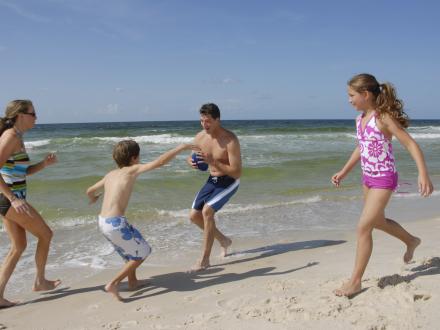 Family plays on Alabama's beaches