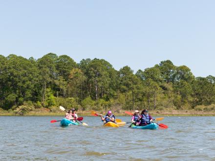 Adults kayaking in Gulf Shores, AL