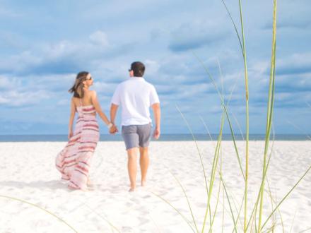 Couple walking on Alabama's Beaches