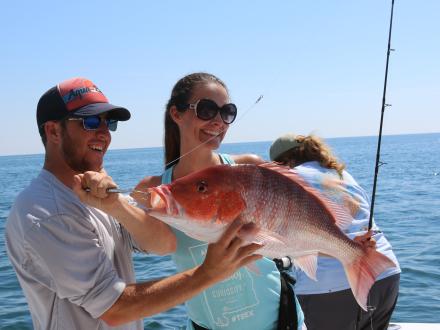 Woman fishing red snapper Orange Beach AL