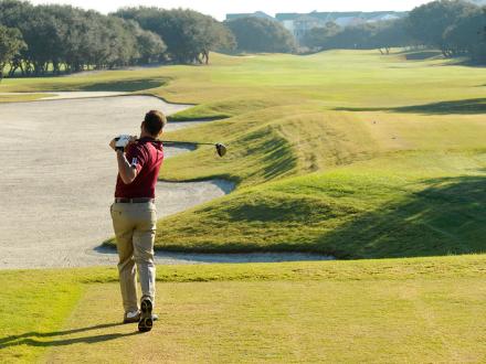 Man golfing Gulf Shores AL