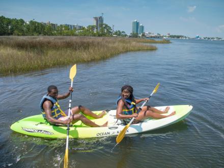 Couple kayaking in Orange Beach, AL