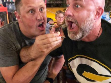 Guys eating food in Gulf Shores, AL