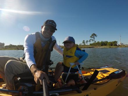 Father and son kayak fishing in Gulf Shores, AL