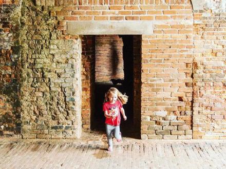 Young girl playing at Fort Morgan in Gulf Shores, AL