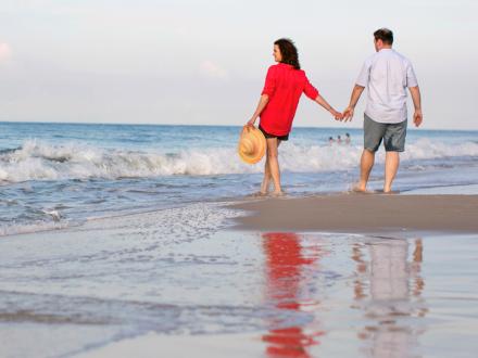 Couple walking on Alabama Beaches