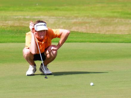 Woman golfing at One Club in Gulf Shores, AL