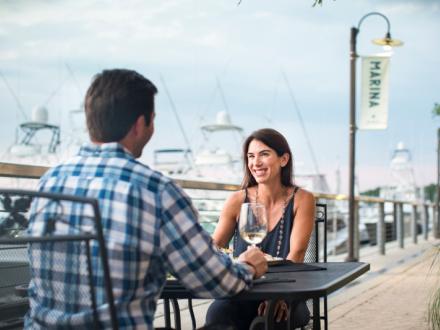 Couple dining at The Wharf in Orange Beach, AL