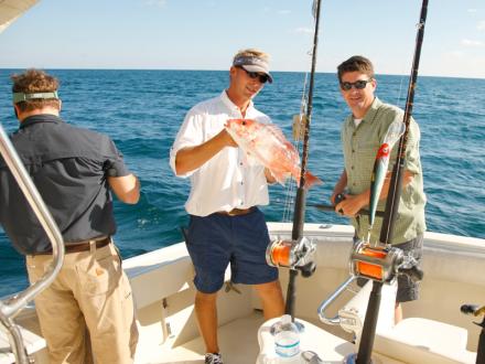Men charter fishing in Orange Beach