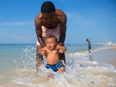 Baby playing on Alabama's Beaches