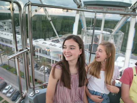 Teens on the Ferris Wheel at The Wharf in Orange Beach