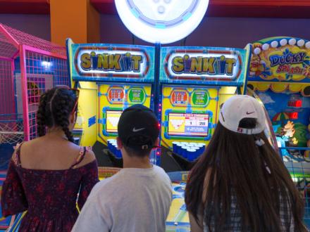 Teens at the arcade at The Track in Gulf Shores