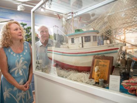 A couple views a maritime exhibit at the Gulf Shores Museum in Gulf Shores, Alabama while learning more about the Alabama’s history.
