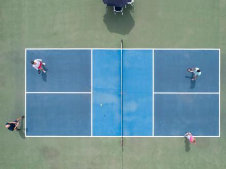 Aerial view of people playing pickleball at One Club in Gulf Shores