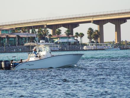 Boat headed into the pass in Orange Beach, AL