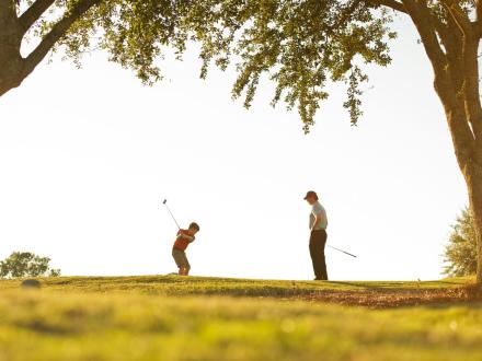 Kid & Dad Golfing Gulf Shores
