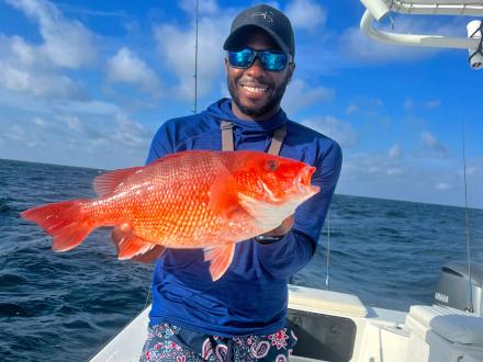 Pond Boy with Red Snapper