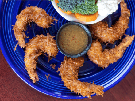 a plate of fried coconut shrimp at DeSoto's Kitchen in Gulf Shores