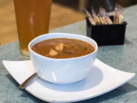 bowl of gumbo and a draft beer at Pier House in Orange Beach