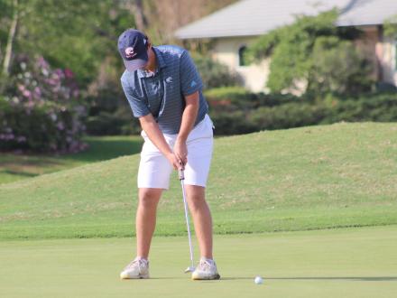 Player putting a golf ball at Craft Farms Golf Course