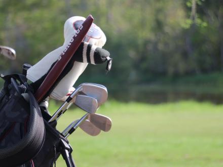 Golf bag on the back of a golf cart