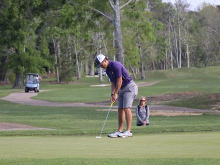 Player putting a golf ball at Craft Farms Golf Course