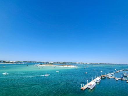 Aerial view of boats in the water near Perido Pass Bridge in Orange Beach