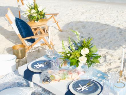 Cute picnic setup on the beach by Southern Charm Picnic Co.