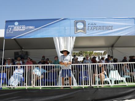 Fans watching the NCAA Beach Volleyball Championship in Gulf Shores
