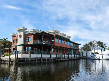 Outside view of Pelican Grill seafood restaurant at San Roc Cay Marina in Orange Beach