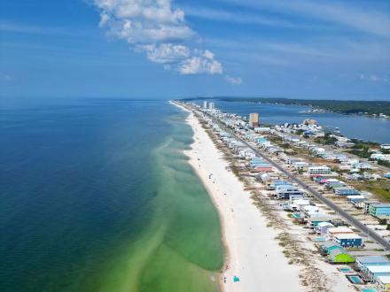 Aerial view of the Gulf and beach houses on Fort Morgan