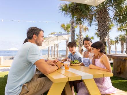 Family dining at The Gulf beachfront restaurant in Orange Beach